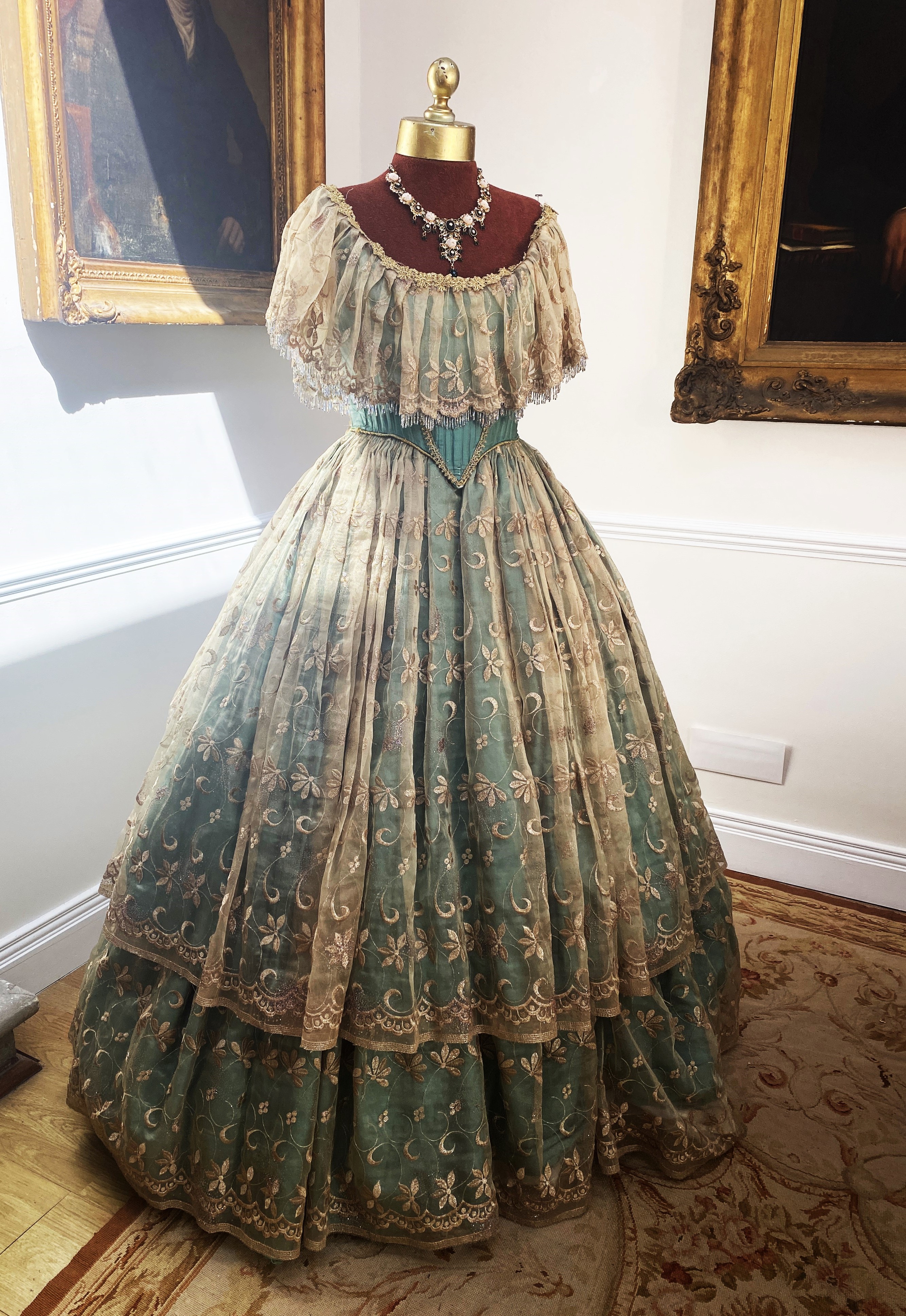 A Victorian style evening gown – green silk with gold transparent overskirt. Size adjustable 10/14